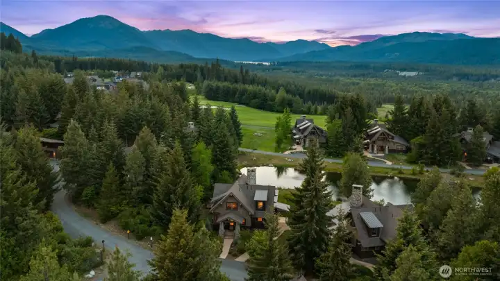 130 Saddle Ridge sits perfectly on the lake. The garage barn is a short distance away.