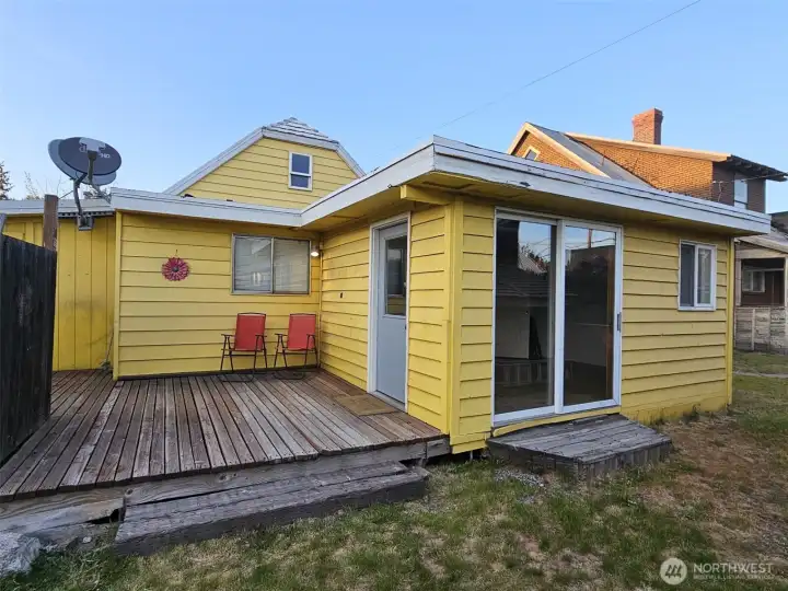 Fully fenced back yard with deck off sunroom, very private