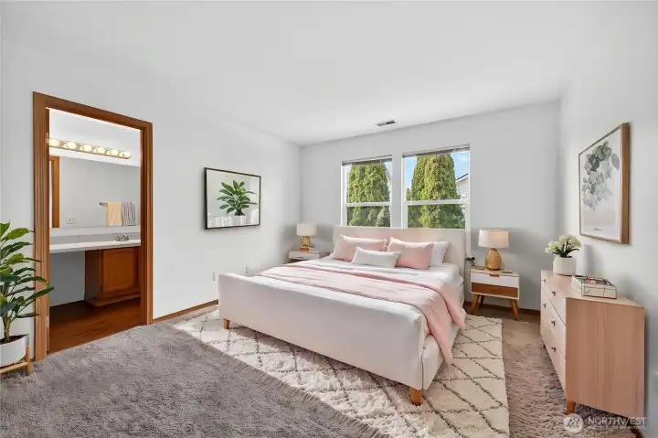 Virtually staged primary suite.