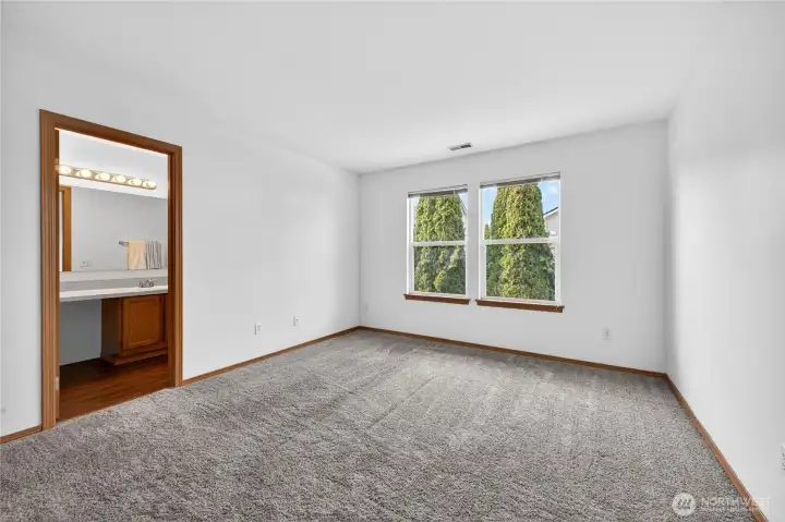 Spacious primary suite featuring a walk-in closet and a private bathroom—your own comfortable retreat at the end of the day.
