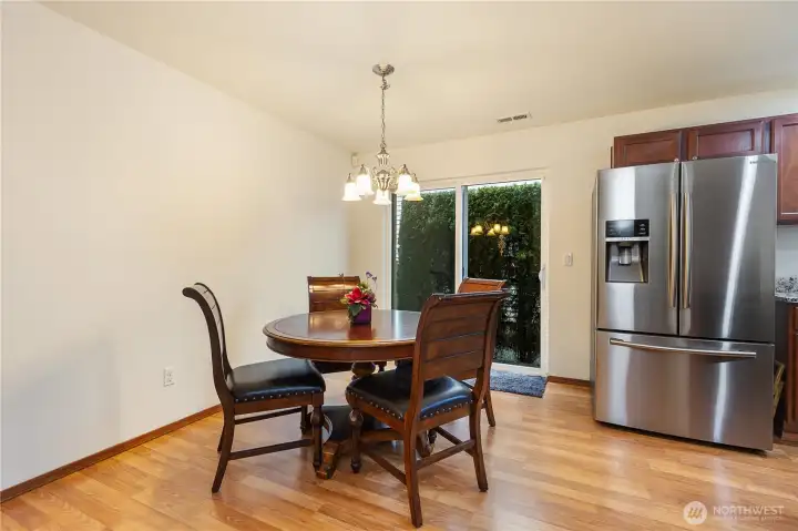 Dining area with sliding doors to outdoor space.