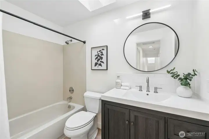 Upper level hall bathroom with new vanity, mirror and lighting