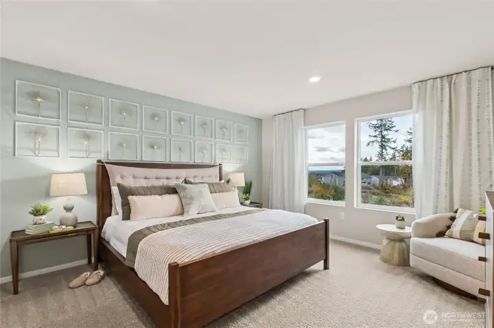 Huge primary bedroom can accommodate a King size mattress, dressers, nightstands, and more. **Photo is representational. Actual home is under construction. Colors, materials, and features may vary. See site agent for details.**