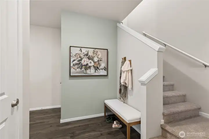 Entry foyer perfect for bench, coat rack, artwork, and more. Photo is representational. Actual home is under construction. Colors, materials, and features may vary. See site agent for details.