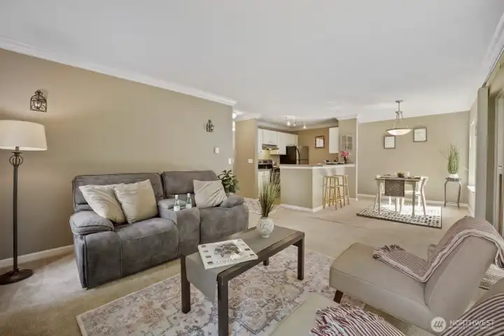 Lovely crown molding & thick beveled baseboard trim throughout home. Carpeting in living, dining, halls & bedrooms