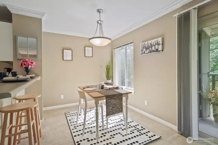 Another view of good sized dining room- notice the little nook in the left corner- plant corner?  They'll love the natural sunlight!  A small desk could also fit