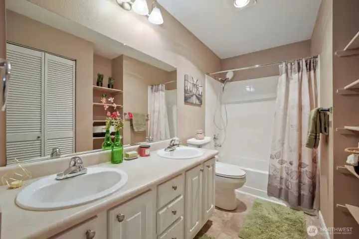 Updated toilet, full shower/tub combo with tile surround, removable shower wand; heat lamp and fan