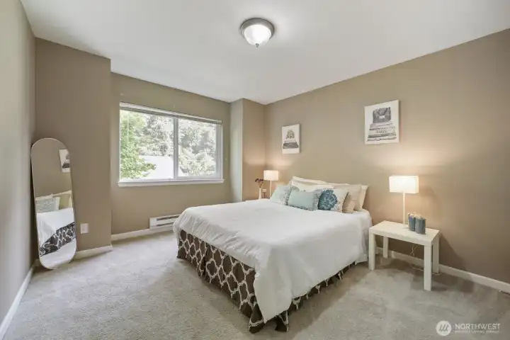 2nd bedroom is also very good sized and offers a lighted walk-in closet as well! Overlooking the parking out front- half of the Maple tree extends to this window for added territorial views