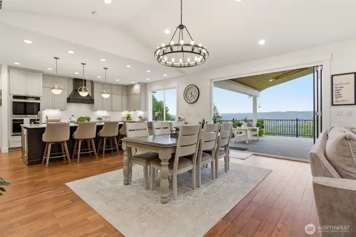 Main house dining room, kitchen and 10' wall of windows.