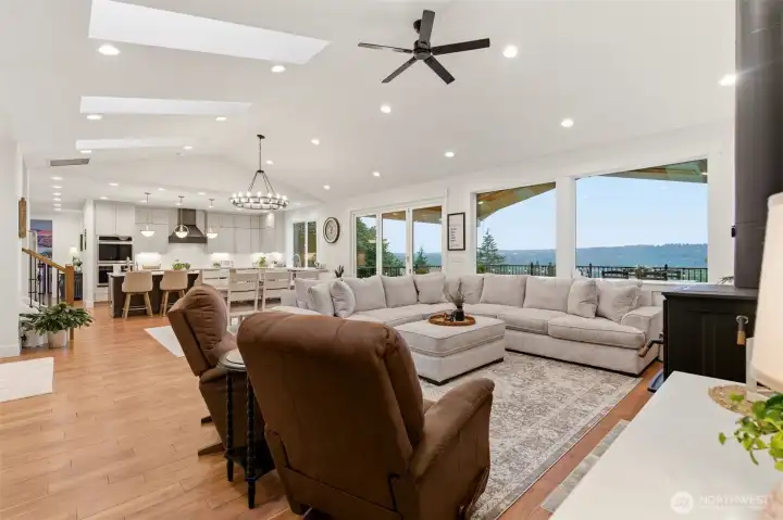 Main house great room with wood burning freestanding fireplace.