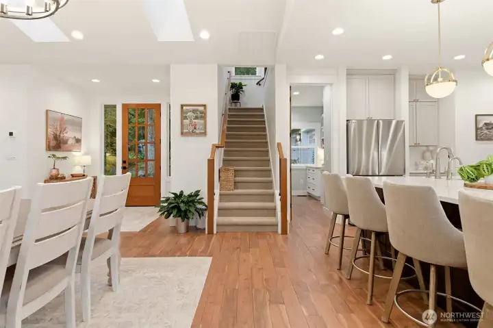 Heading upstairs at the main house with the front door on the left and chiefs pantry on the right.