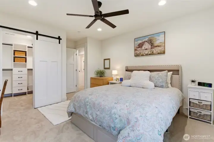 Upstairs bedroom with walk in closet in the main house.