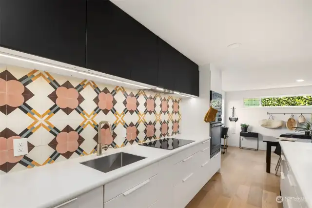 The crisp and clean cabinetry against these stunning tiles are the perfect place to meal prep.