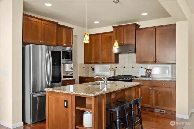 A large center Kitchen island is great for gatherings.