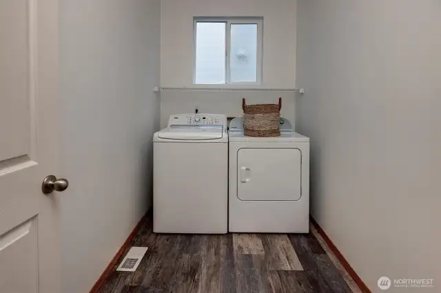 Large utility room on main with window.