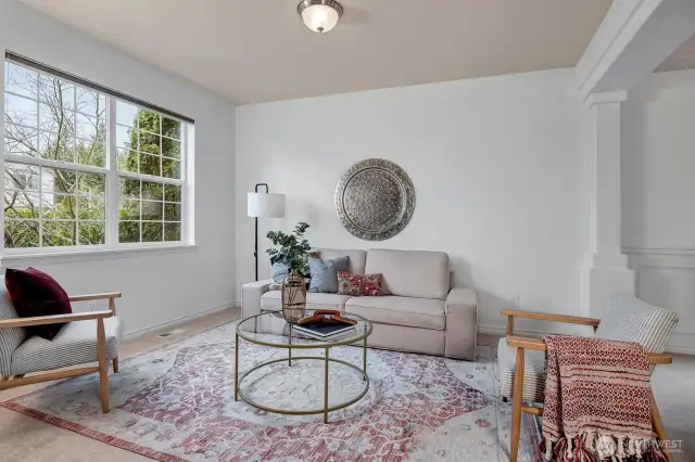 The formal living room flows gracefully into the elegant dining room.