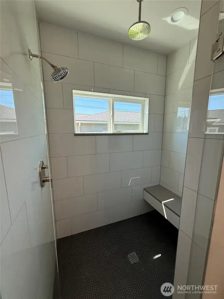 Primary walk-in tiled shower