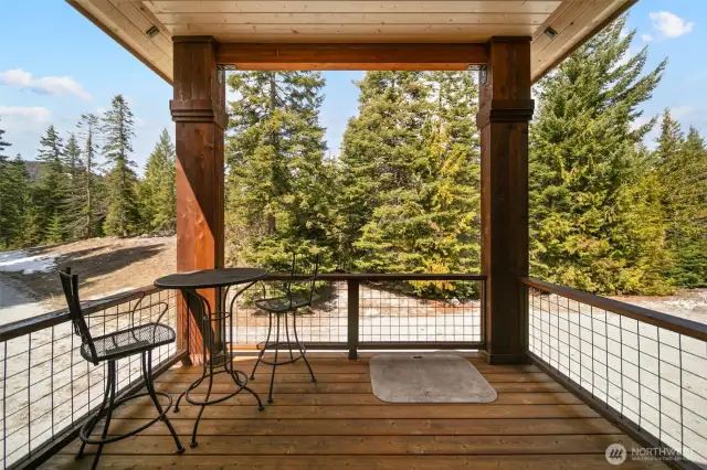 Upstairs sofit covered porch is perfect for Rib Eyes charred on the BBQ.