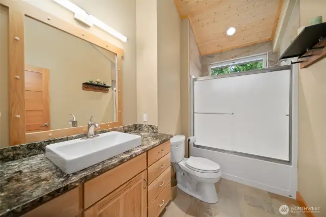 Upstairs gorgeous full bathroom has heated ceramic tile flooring.