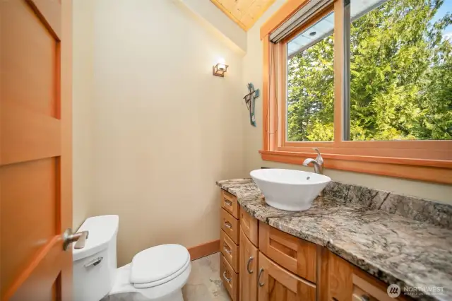 Tastefully appointed 1/2 bath in Primary bedroom