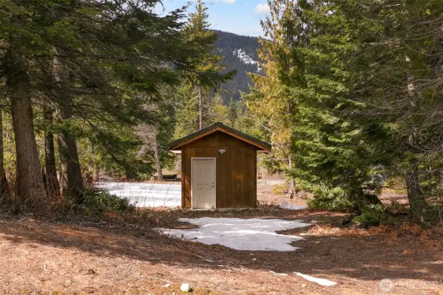 Pump house for well with water softener and storage space.