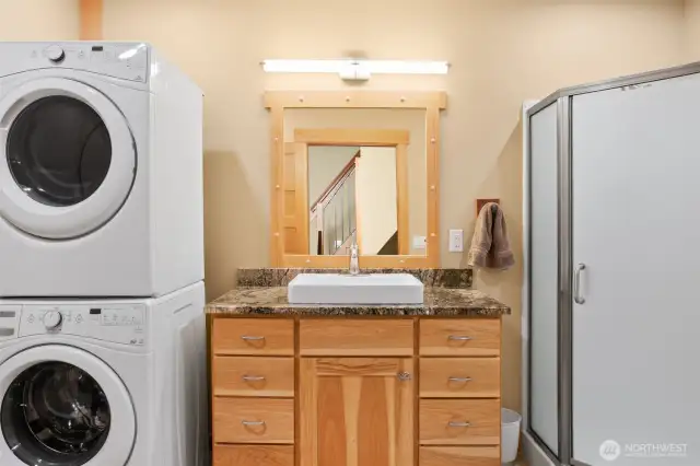 Main floor bathroom with shower and Laundry of bunk house living space.