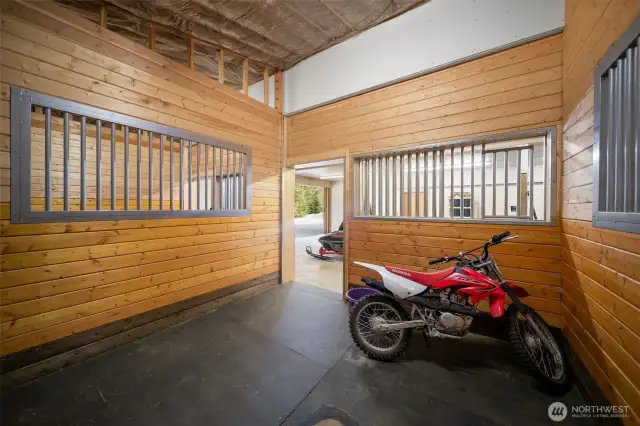 Four state of the art 12x12 rubber matted animal stalls with sliding door access inside and outside,  each with it's own floor drain and split outside doors run the full length of the main floor on the west side.   Bring your ponies or other furry livestock friends.