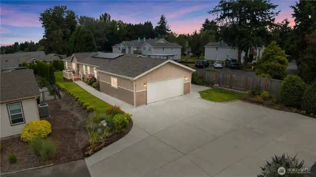 Large back patio off garage by vines and berries to enjoy Spring, summer and fall on!