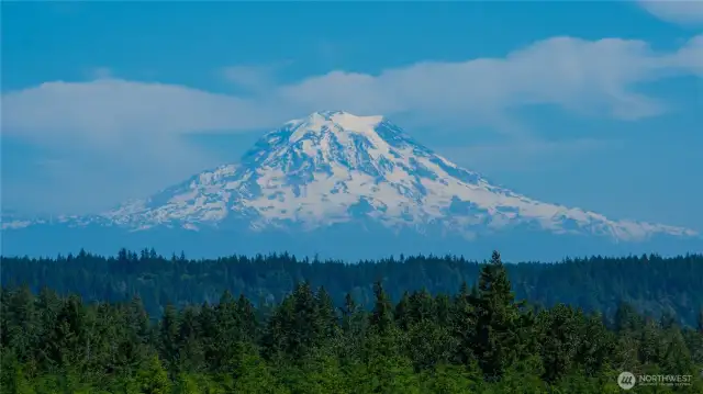 Imagine sitting on your deck & watching Mt Rainier in all her glory. As well, the skyscape is enormous. Imagine the night & moonlit skies! Telephoto was used to enhance being able to see so many glaciers.