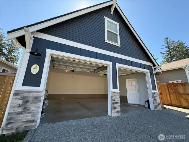 The large double garage is perfect for projects and car storage.  There are two garage door openers for ease!