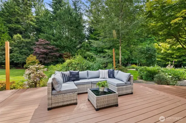 Back deck off the family room/kitchen area.  The posts are there because this area has a cover that provides shade on those hot summer days.  What a great spot to sit out and enjoy the serene surroundings.