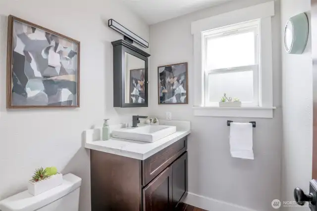 Stylish, updated half bath off eat-in & 2nd living area on main