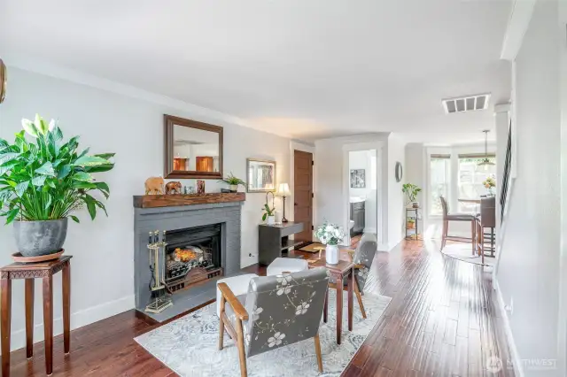 Gas fireplace, hardwoods and deeper, darker vibe sets the mood in the secondary living space