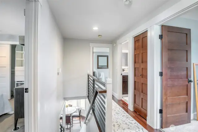 Landing and hall on upper level feature beautiful hardwoods