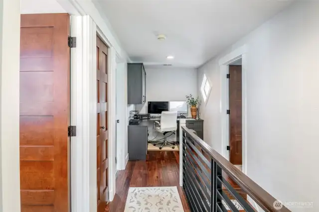 Landing on upper level offers flex space, currently used as an office