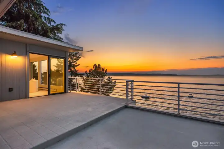 The upper deck highlighted here: sizable and open to the elements. It is rare along the local waterfront to enjoy such extensive decks (found on each level). Truly the ideal place for future plantings like tomatoes & vegetables, herbs, potted trees, and lounging chairs.