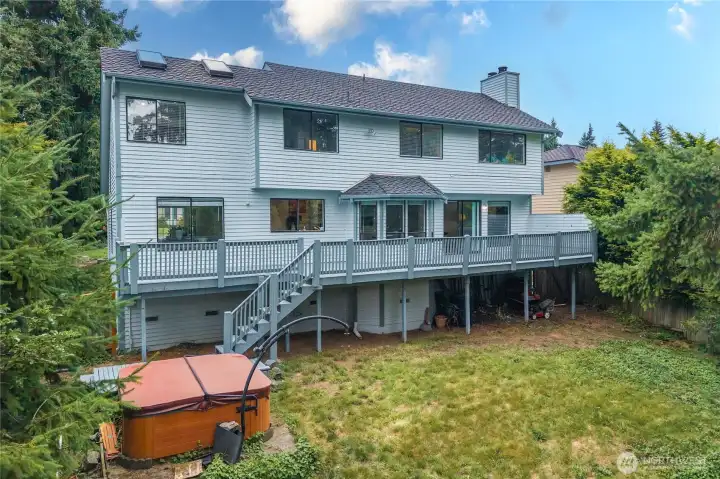 The fully fenced backyard is spacious and ready for your own customization.