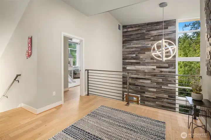 A large loft is wired for media or to be an additional gathering spot