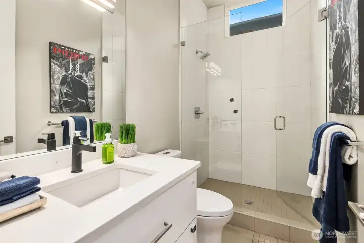 Main floor bathroom including shower for supporting main floor living