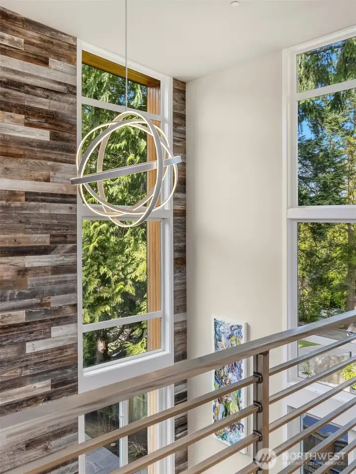 Remote work friendly.   Winter snowfalls and changing light look magical in the soaring walls of windows connecting to nature