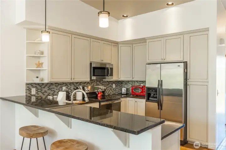 Kitchen with white cabinetry.  All of the condo is turnkey including the kitchen.