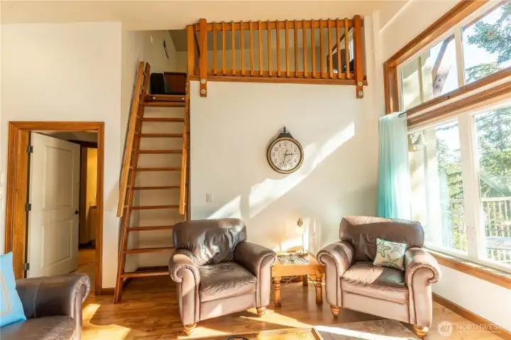 Ladder leads up to the loft that could be used as an office, den/family room and could sleep two people as well.
