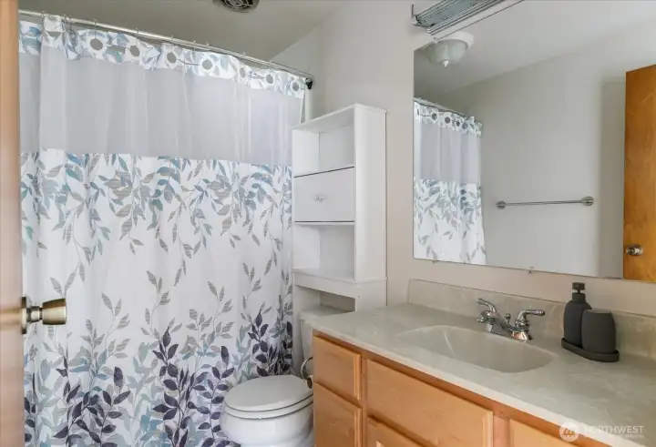 Main bath. Shower/tub combo.