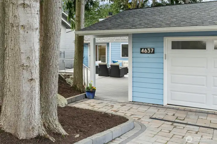 Beautiful pavers with inset lighting. Drive by in the evening to see the magical effect in combination with professionally uplighted trees.