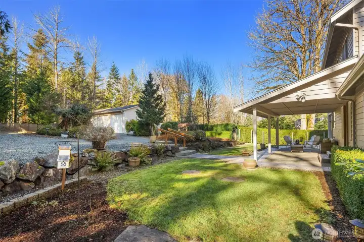 Back yard. There are several other back yard spaces. A horse-shoe pit and room for gardens.