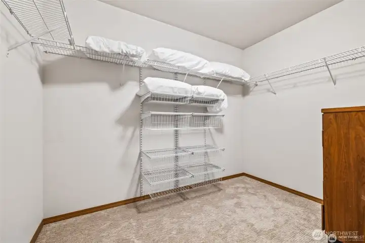 Large walk-in closet with ample storage for everything.