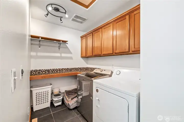 Convenient upstairs laundry room to make chores easier.