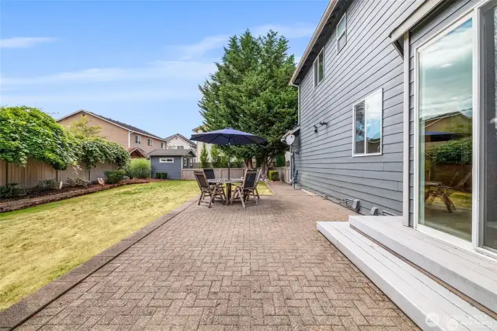Large paver patio, perfect for BBQs and outdoor gatherings.