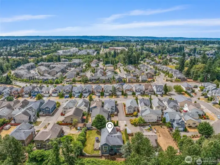 Aerial views showcase the large lot and quiet neighborhood.