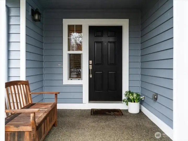 A welcoming covered front porch to greet your guests and keep them dry